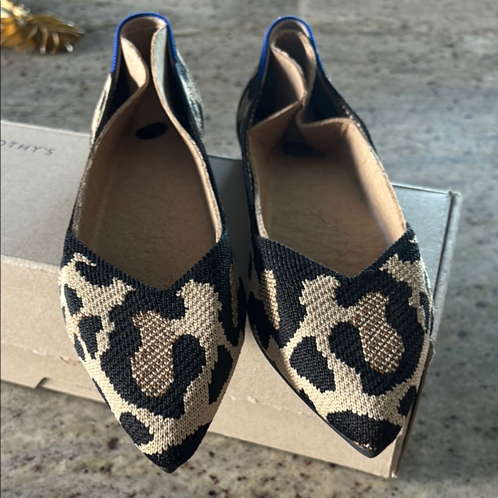 Rothy's Black and Cream Flats with Animal Print